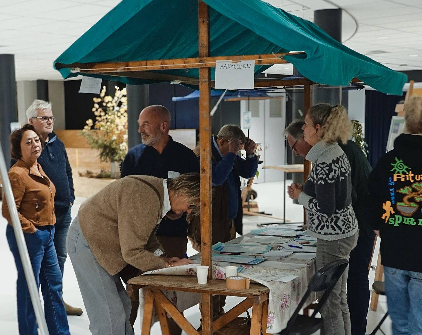 Bezoekers melden zich aan bij Groen moet je doen